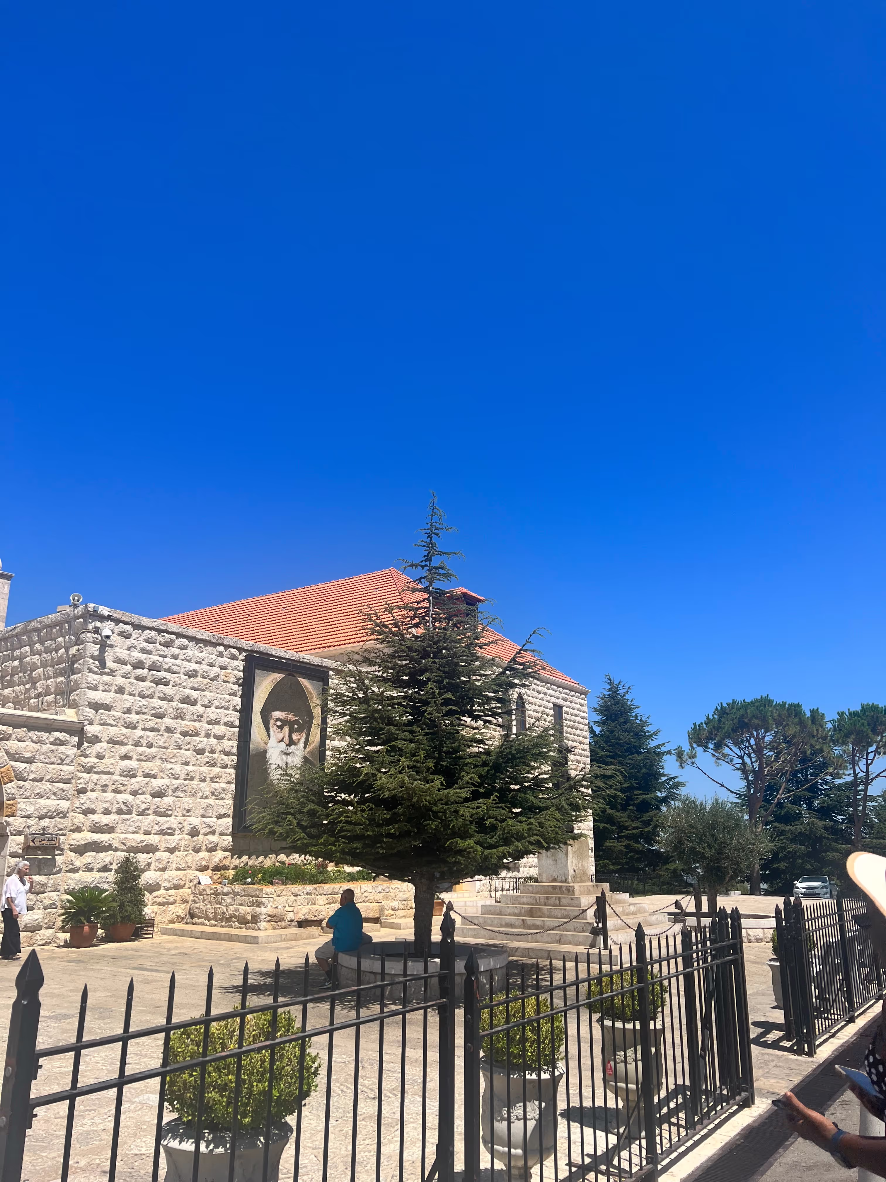 A stone monastery beneath a vivid blue sky