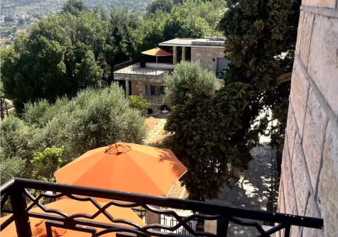 A hillside terrace surrounded by trees