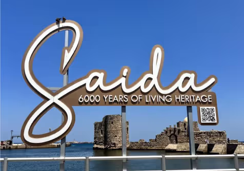 The Saida heritage sign beside the sea